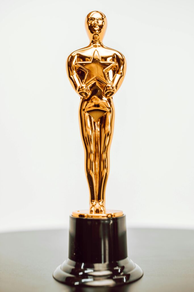 Close-up of a golden star trophy on a dark base, symbolizing achievement and excellence.